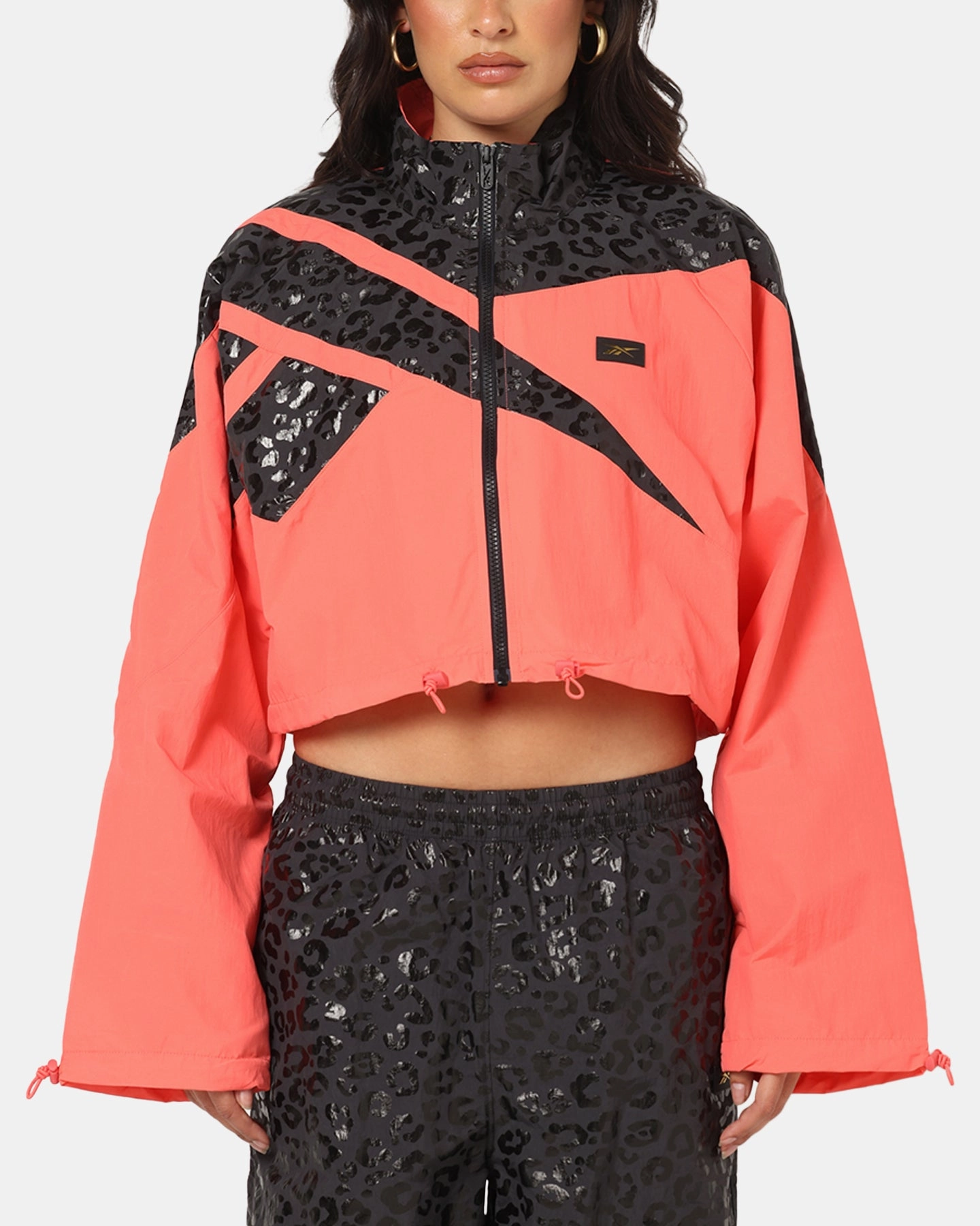 LowMaintenance Reebok X Angel Reese Women's Vector Track Jacket Coral